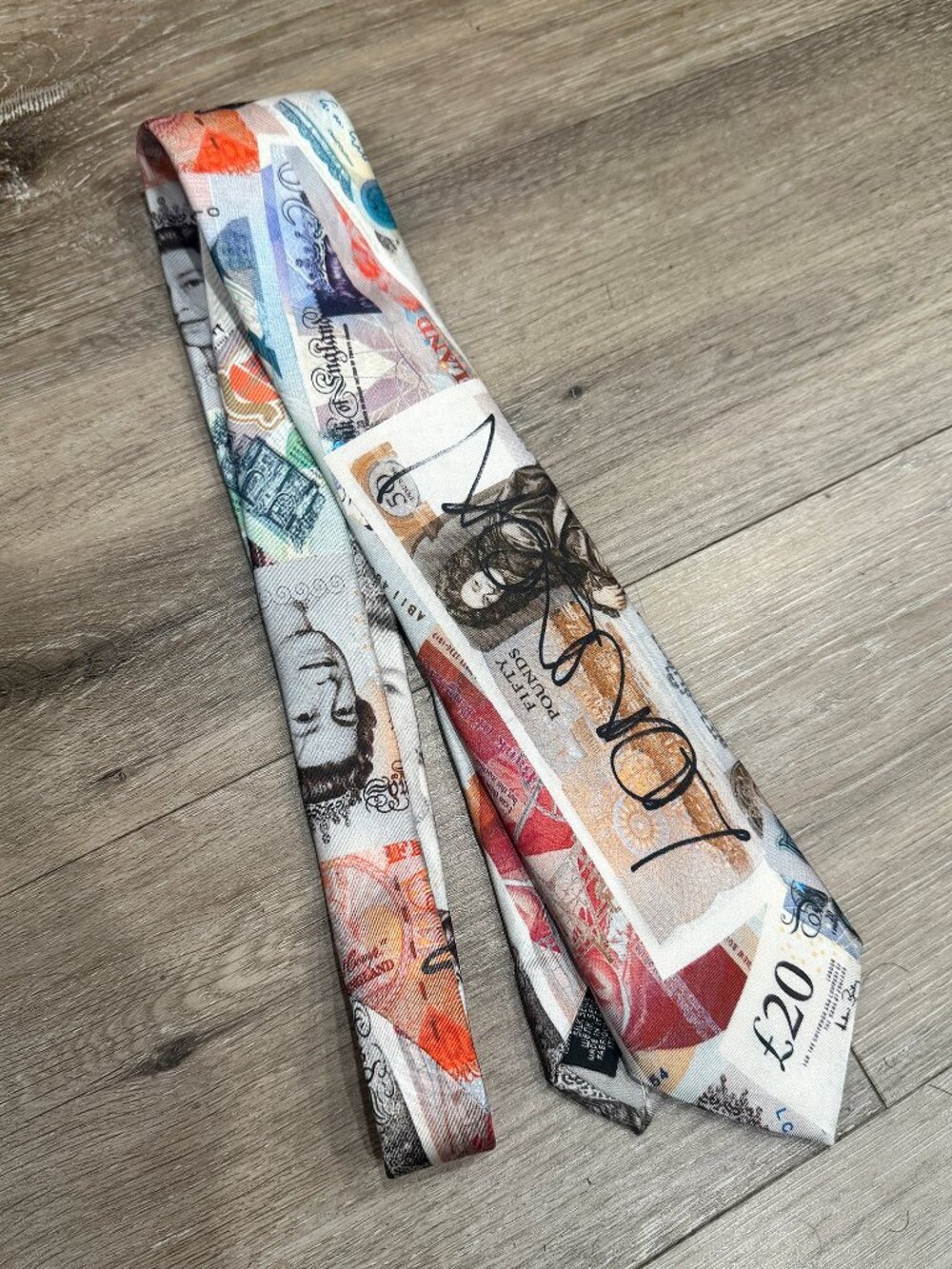 Vivienne Westwood silk tie featuring the iconic "Money" or "Currency" print.